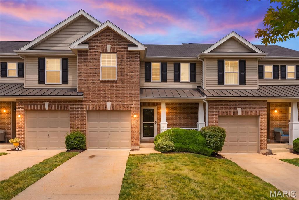 Welcome home to 53 Country Village Drive in the highly desirable Countryshire community, conveniently located near Liberty High School and offering an abundance of neighborhood amenities.  Tucked away on a quiet cul-de-sac with visitor parking right next door, this charming townhouse combines convenience and low-maintenance living.  A long driveway provides tandem parking in addition to the attached one-car garage, while the inviting covered front porch creates the perfect place for a rocking chair.  Step inside to find beautiful wood flooring in the entry, leading into a well-appointed kitchen featuring tall cabinetry, black appliances, and a pantry.  The open-concept living and dining area is filled with natural light and showcases a vaulted ceiling, fresh paint throughout, and brand-new luxury plank flooring, creating a bright and welcoming space.  The main level also offers the convenience of a laundry closet with hookups and a spacious primary bedroom with large walk-in closet.  Upstairs, you'll find new carpeting, a versatile loft that's ideal for a home office, reading nook, or playroom, along with a generous second bedroom and a full bathroom.  The unfinished lower level provides outstanding storage and future expansion potential with a rough-in for an additional bathroom.  Step outside to enjoy the wood deck, perfect for grilling or relaxing outdoors.  Whether you're looking for your first home or seeking a low-maintenance lifestyle, this move-in-ready townhouse is a home you'll love coming home to.