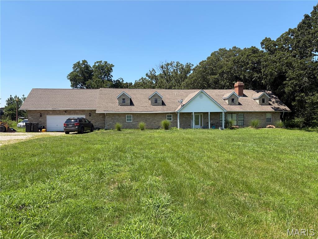 Large home perfect for a large family!!   One level living and in the country!!  Home has an open floor plan with big rooms!!  3 bedrooms, 2 baths, bonus room, nice oversized back porch and 2 car garage.  All sitting on 3 plus acres.  Call today!