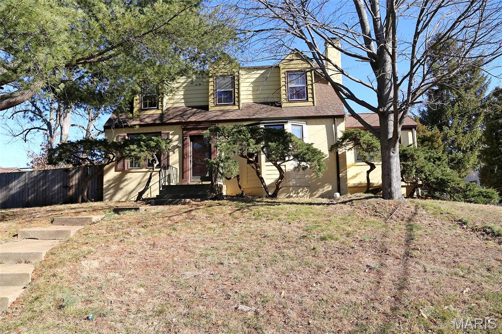 Looking for an opportunity to renovate a 4-bedroom brick home in Chafford Woods subdivision?  Great central location . The kitchen needs a total redo. Flooring slate from old roofs.Main level bedroom and bath. Upstairs are 3 more bedrooms and a bath.  Also, a 2-car garage! Approx 2160 sq ft according to county records. The brick archway in kitchen was done by the owner and a neighbor who was a bricklayer. (Homes in the neighborhood are selling in the high $400's, and one is currently on the market for $524,900.) This house sits on Lot 1.  Lot 2 is for sale for $235,000. Most of the patio in the side yard is being removed because of encroachment on lot 2. About 4 feet of concrete will be left on lot 1. Lot 2 begins about 5ft from the back of the house.  Richmond Heights requires new construction to be at least 6ft from the property line. Most of the backyard for lot 1 is behind the garage. Seller would prefer an As-Is contract.