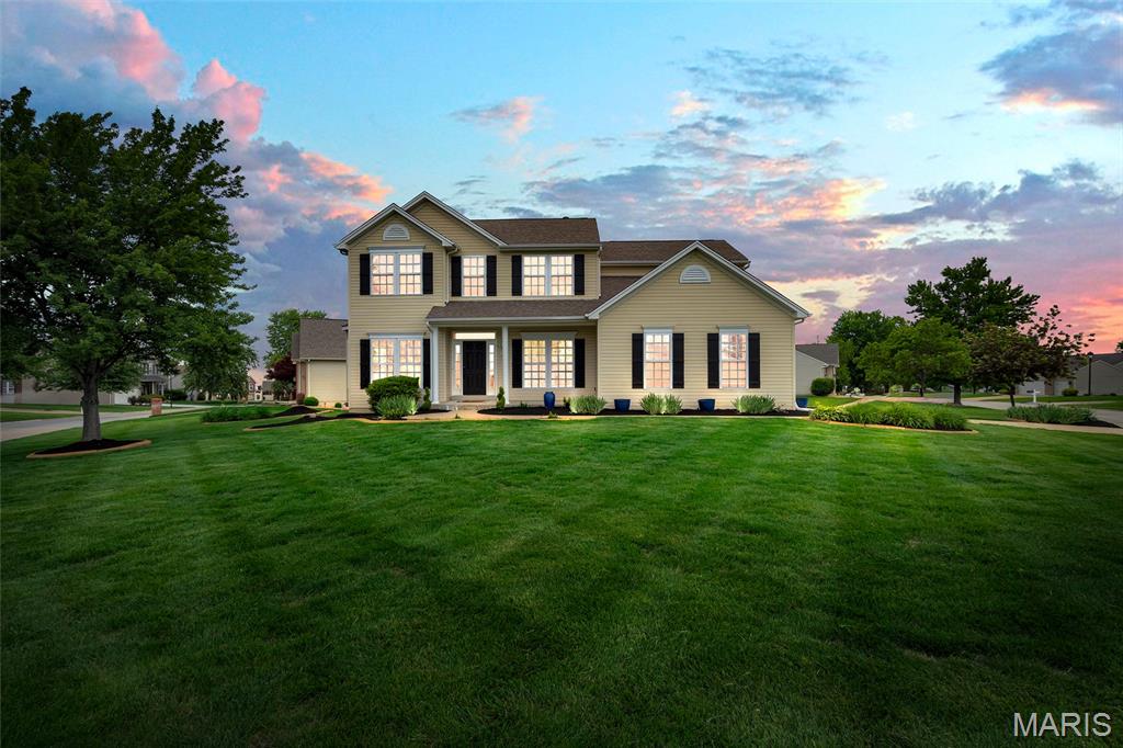 Get ready to FALL IN LOVE with 8103 Glen Arbor Drive in Lake St. Louis! Offering over 3,100 square feet of living space, this former display home has been beautifully refreshed and is completely move-in ready. From the moment you walk in, you’ll be impressed by the abundance of natural light, fresh paint, new carpet, updated light fixtures, and the spacious feel created by the 9-foot ceilings throughout the main level. The main floor features gorgeous hardwood floors, a cozy gas fireplace, and an open layout designed for both comfortable everyday living and entertaining. Work-at-homers can utilize the main floor office space! An edgy, custom accent wall is the highlight of the dining room. The kitchen shines with brand-new stainless steel appliances, a gas range, white 42” cabinetry, and ample prep space. Just off the kitchen, the stunning hearth room offers a vaulted ceiling and sliding glass doors leading to the deck—creating the perfect gathering space indoors and out. The main-floor laundry room includes a custom-built drop center bench for added style and functionality, along with a brand-new washer and dryer that stay with the home. Upstairs, double doors open into the massive 20x18 primary suite featuring vaulted ceilings, a large walk-in closet, and a spa-like bathroom complete with dual sink vanities, a walk-in shower, and a relaxing soaker tub. Three additional generously sized bedrooms and another full bathroom complete the upper level. The walkout lower level offers endless possibilities with a large unfinished space already roughed in for an additional bathroom and ready for your finishing touches. On the opposite side of the basement, you’ll find a separate 5th bedroom that would make an ideal in-law suite, home office, workout room, or guest space. Additional highlights include dual-zoned HVAC, an irrigation system, remote-controlled exterior lighting, whole-home speaker system, and a transferable HSA Home Warranty with 7-Star Upgrade coverage through 3/31/27. Located in the highly rated Wentzville School District and close to shopping, dining, parks, and major highways, this home truly has it all!