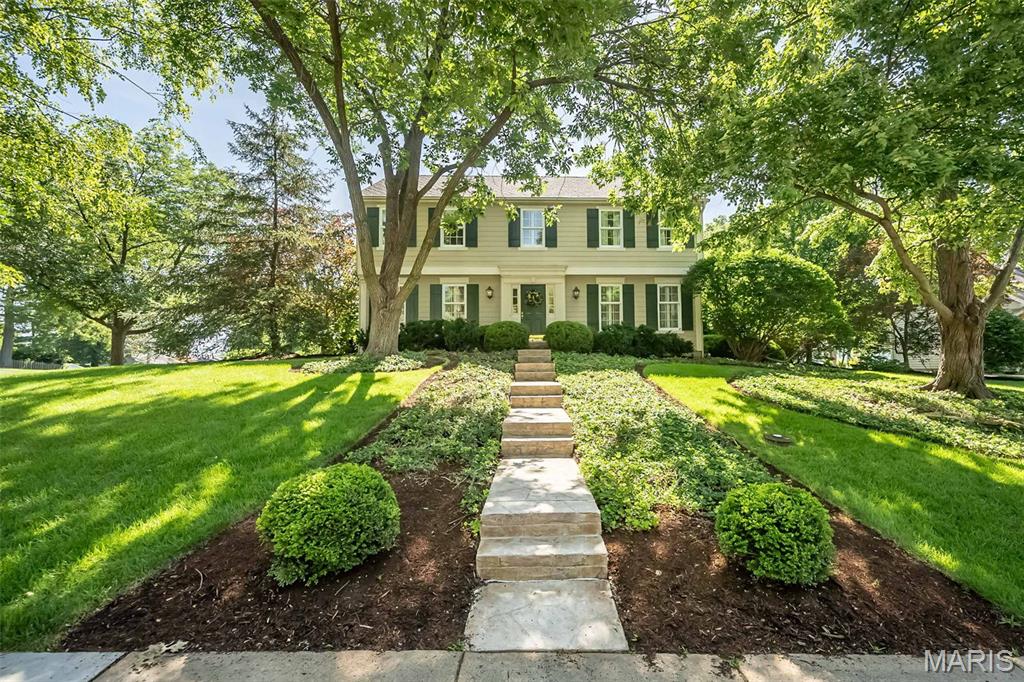 Welcome to 816 Twin Pine Drive ~ a special one-of-a-kind storybook treasure that's perfectly situated on a picturesque .37-acre lot in the highly sought-after Waterford Place that offers a rare combination of privacy and beauty in an unparalleled setting. From the moment you arrive, you'll be captivated by its inviting warmth, refined sophistication, exceptional craftsmanship and timeless elegance. Every detail has been thoughtfully considered from the carefully curated designer finishes to the sophisticated touches that elevate each space respectively. The gracious entry foyer welcomes you inside leading you into the sun-drenched living room with rich hardwood floors, elegant moldings, plantation shutters and custom built-ins that beautifully frame the charming bay window. The family room is a true showpiece highlighted by the striking beamed ceiling, dramatic wall of windows that flood the space with natural light and custom built-ins that flank the floor-to-ceiling brick fireplace. The elegant dining room features designer wallpaper, classic moldings, plantation shutters and a gorgeous brass chandelier. A convenient butler’s door provides an effortless connection to the kitchen perfect for both everyday ease and entertaining. Love to cook? Designed with both style and function in mind, the bright cheerful kitchen is exceptionally well-appointed with beautiful Brookhaven cabinetry featuring thoughtful storage/pull-outs, solid-surface countertops, convenient planning desk and high-end appliances including a Sub-Zero refrigerator. A comfortable sitting room offers seamless access to the attached garage as well as the outdoor living spaces, creating an easy and practical connection between indoors and out. The magazine-worthy powder room impresses with ornate gold sconces, chic wallpaper and a custom built vanity with elegant gold-accented hardware. Upstairs, the bedroom level reveals a spacious primary retreat complete with a generous walk-in closet, versatile dressing room/office and a beautifully updated spa-like bath with Brookhaven cabinet vanity, large walk-in shower and oversized jetted/soaking tub creating a serene luxurious escape. Three additional bedrooms each offer double closets with custom organizational systems and share the equally impressive hall bath featuring an oversized jetted tub/shower combination complemented by a stylish vanity with integrated wall cabinetry for added storage and convenience.
The unfinished lower level offers an exceptional opportunity to be completed creating additional living space while adding significant long-term value and equity to the home. The enchanting backyard/courtyard offers a truly magical setting featuring brick paver patio and walkways, mature landscaping and lush trees that envelop the space in natural beauty and create a calm peaceful atmosphere. Not to miss: inground sprinkler system, HVAC/Humidifier (2019), meticulously maintained systems, wonderful community, FABULOUS location in close proximity to top rated schools, churches, shopping, restaurants and more!