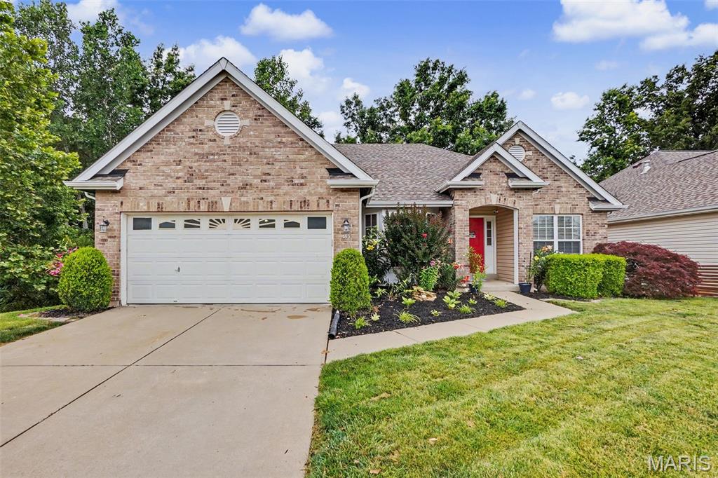 Welcome home to 185 Roxbury Dr. Pride of ownership is on full display as you’re sure to adore this eye-catching five-bedroom, three-bathroom, well updated and freshly landscaped O'Fallon atrium ranch. Space will not be an issue in this lovely property which offers plenty of room to spread out, featuring a handsome brick front elevation, strong curb appeal, a spacious two-car garage, and backyard that backs to a peaceful, slightly wooded area. Step through the foyer and drop your coats before entering the impressive family room, which boasts lofted ceilings and a stunning wall of windows that flood the space with natural light. Off the living room, you’re greeted by a gorgeous kitchen that offers an abundance of custom cabinetry, granite countertops, a large center island, stainless steel appliances, and a generous dining area that walks out to a relaxing deck—perfect for morning coffee or weekend gatherings with plenty of deer company as well. The main floor also includes a convenient laundry room. The luxurious primary suite features a beautiful coffered ceiling, a massive walk-in closet, and a stunning en suite bathroom, an oversized soaking tub, and a walk-in glass shower. The finished lower level is sure to impress as well, offering a sizable entertainment area, a stylish bar, 2 additional bedrooms, and an additional full bath, completed with a walkout to the patio. Tour this fantastic home soon and make it yours today!