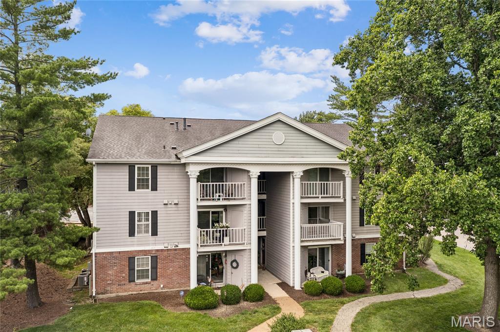Welcome back to 12818 Portulaca Drive in Creve Coeur, because apparently this building just cannot stop delivering! Unit E is stepping into the spotlight and she brought upgrades. This bright and beautifully maintained 2-bedroom, 2-full bathroom condo is ready to impress from the moment you walk through the door, and trust us, it absolutely delivers. The larger updated kitchen is the real showstopper here, offering more counter space, more cabinet space, and more reasons to finally pretend you cook. Hardwood flooring flows throughout the main living areas giving the space that warm, polished look that makes every room feel like it was designed with intention, and brand new carpet in both generously sized bedrooms means your feet will thank you every single morning. Closet space is abundant throughout because nobody has ever complained about having too much storage. Here is where it gets really good though. This is maintenance free living at its finest. No yard to mow, no exterior to paint, no weekends lost to a honey-do list that never ends. Just lock the door and go live your life. Speaking of living your life, the location here is genuinely hard to beat. You are minutes from some of the best dining in all of St. Louis County including Timothy's for an elevated night out, Il Bel Lago on Olive for Italian that will make you question every pasta decision you have made before, Gioia's Deli when you need a legendary hot salami sandwich immediately, and Nudo House for ramen that hits every single time. Cooper's Hawk is right down the road for wine club Wednesdays, and Westport Social is nearby when you want ping pong, drinks, and good company all in the same place. Creve Coeur Lake Memorial Park offers over 320 acres of trails, water, and green space for when you need to touch grass, and the Butterfly House at Faust Park is right around the corner for the days you need a little wonder in your life. Easy highway access means downtown, Clayton, and the rest of the metro are always within reach. This one is truly move-in ready and priced to move, so schedule your showing today before someone else beats you to the door!