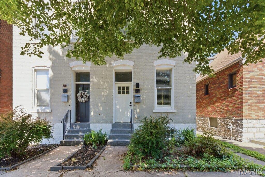 Historic charm meets smart-home living in the heart of Gravois Park. This beautifully renovated 2-bedroom, 1.5-bath townhome offers the character buyers love—with all the modern updates they want.

From the moment you step inside, you'll appreciate the soaring ceilings, rich hardwood floors, custom millwork, and bright open-concept layout designed for both everyday living and entertaining. The stylish kitchen is a standout, featuring quartz countertops, custom cabinetry, a bold designer backsplash, and sleek GE Slate appliances.

Upstairs, two spacious bedrooms and a magazine-worthy full bath create the perfect retreat, complete with convenient second-floor laundry. Smart-home technology is integrated throughout, including Nest thermostat, smart locks, security system, Lutron Caseta lighting, Google Home compatibility, and Cat 6 networking.

Major system updates completed in 2020—including electrical, HVAC, and roof—provide added peace of mind. Outside, enjoy a private fenced backyard perfect for pets, gardening, relaxing, or hosting friends.