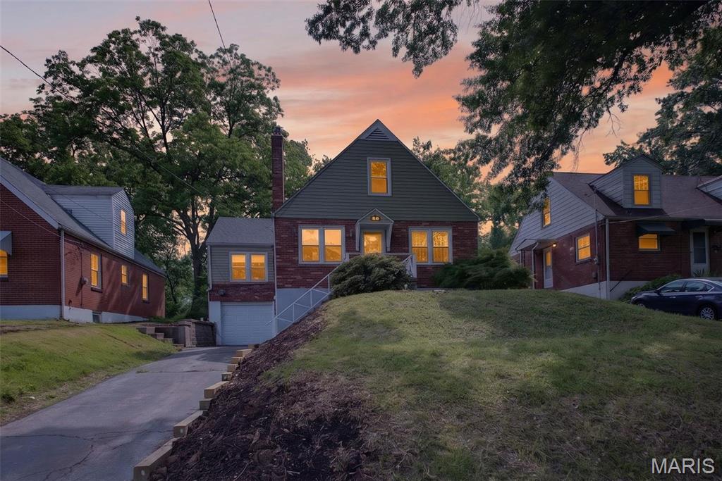 Beautifully renovated all-brick home in the heart of Ferguson! This move-in ready property blends classic charm with modern updates throughout. Step inside to find refinished hardwood floors, fresh paint, updated lighting, and a spacious living room featuring a cozy fireplace and built-in shelving. The fully updated kitchen offers modern cabinetry, sleek finishes, and plenty of space for everyday living and entertaining. Updated bathrooms on multiple levels add convenience and style, while the versatile upper-level bedroom provides the perfect private retreat, office, or flex space. The full basement offers tons of storage and additional potential. Outside, enjoy a large fenced backyard, enclosed back porch, and attached garage. Conveniently located near shopping, parks, restaurants, and major highways — this one is truly turnkey and ready for its next owner!