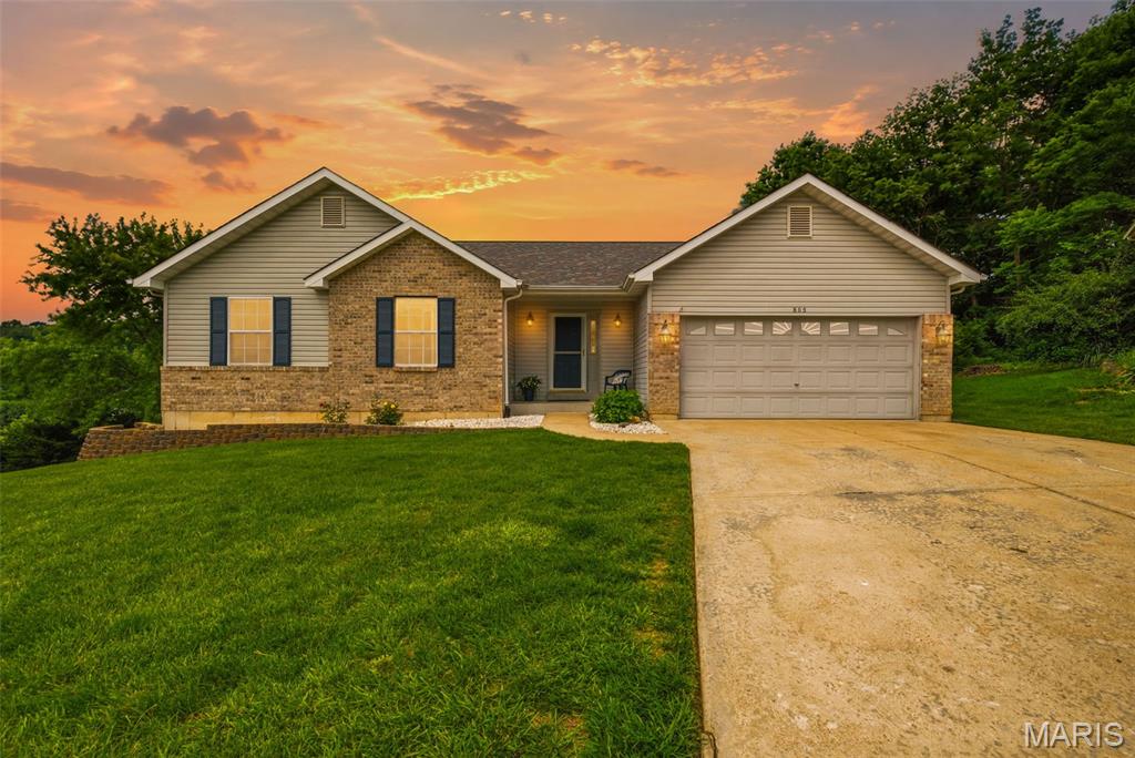 Beautiful Brick and Vinyl Ranch home with BRAND NEW DECK, amazing updates including BRAND NEW DECK. This home was also well loved and taken care of. Basement is finished with a walk out. Located at the end of a Cul-de-sac. Back yard is amazing as you look over Winter Valley. The front door opens to a grand scene in the Vaulted Great Rm with brick fireplace opens to the Breakfast Rm which walks out to the BRAND NEW MASSIVE DECK plus it opens to the Breakfast Room with Breakfast Bar. The Granite countertops, stainless appliances, new carpeting, hardwood floors and interior repaint is just the beginning. MAIN FLOOR LAUNDRY welcomes you in from the garage. The FINISHED walk out lower level walks out to a covered patio and opens to a huge backyard. Stunningly beautiful and ready for you!