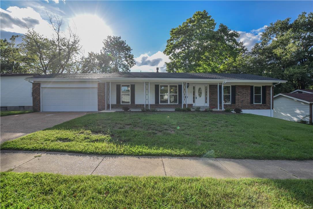 Welcome to this Stunning Renovation with over 2300 sq. feet of finished living space! This 3 bedroom, 3 bath ranch home is nestled between I-270 & Hwy. 364. 2016 Updates include: Entire Kitchen including new Expresso Cabinets, Granite counters, center island & stainless steel appliances including smooth top range, dishwasher and built in microwave.  Fresh paint, light fixtures & refinished hardwood floors throughout. Gas fireplace in living room. New french doors with glass enclosed blinds at deck off breakfast room, overlooks large yard backing to trees. Carpet in lower level. Landscaping. New Architectural shingled roof. Lower level features a large "L" shaped Family/Rec Room with 2 additional rooms (one with closet). This home also has a neighborhood pool that is perfect for summer relaxing!(fees apply).Two car garage with automatic opener, key pad and large storage area partitioned. Come quick to check it out for yourself! It is sure to sell fast with everything it has to offer!