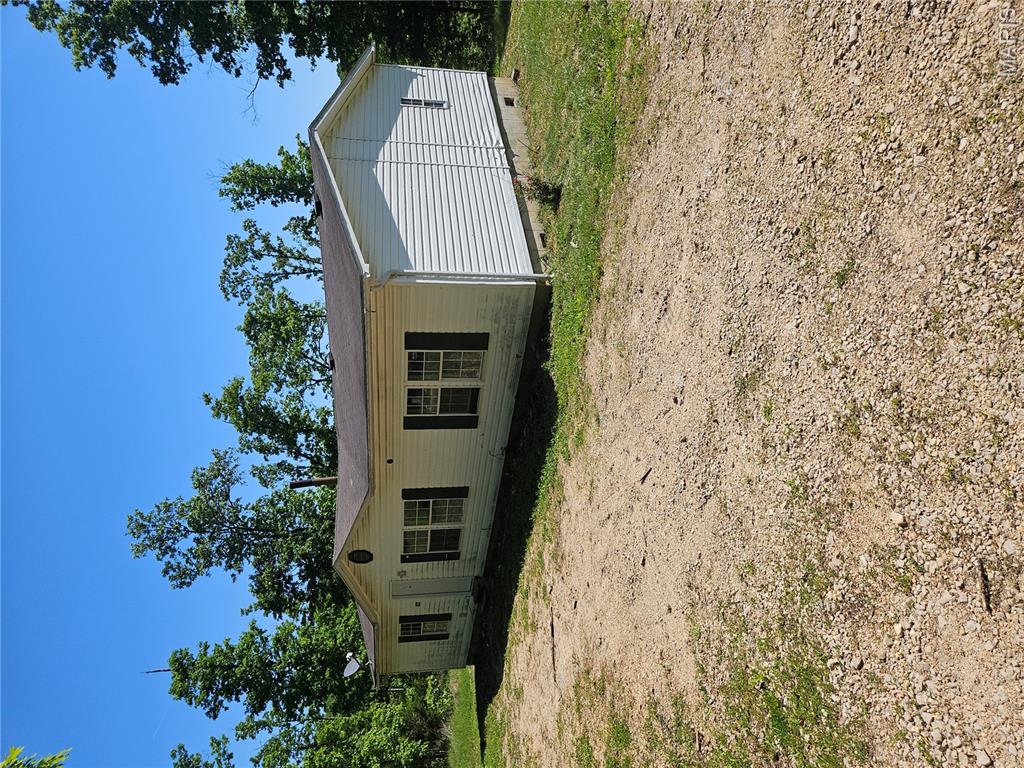Investor special with acreage! This 3 bed, 2 bath manufactured home sits on 5.35 acres at the end of the road in a quiet country neighborhood, offering privacy, space, and incredible potential. The home has solid bones and is ready for your vision with cosmetic updates to make it shine again. With over 5 acres to work with, there’s plenty of room to expand, add outbuildings, create a mini-farm, or simply enjoy the peaceful rural setting. Ideal opportunity for investors, flippers, or sweat-equity buyers looking to build value in a great location. Property is being sold as-is. Utilities are not active—please bring a flashlight for showings. Endless possibilities await!