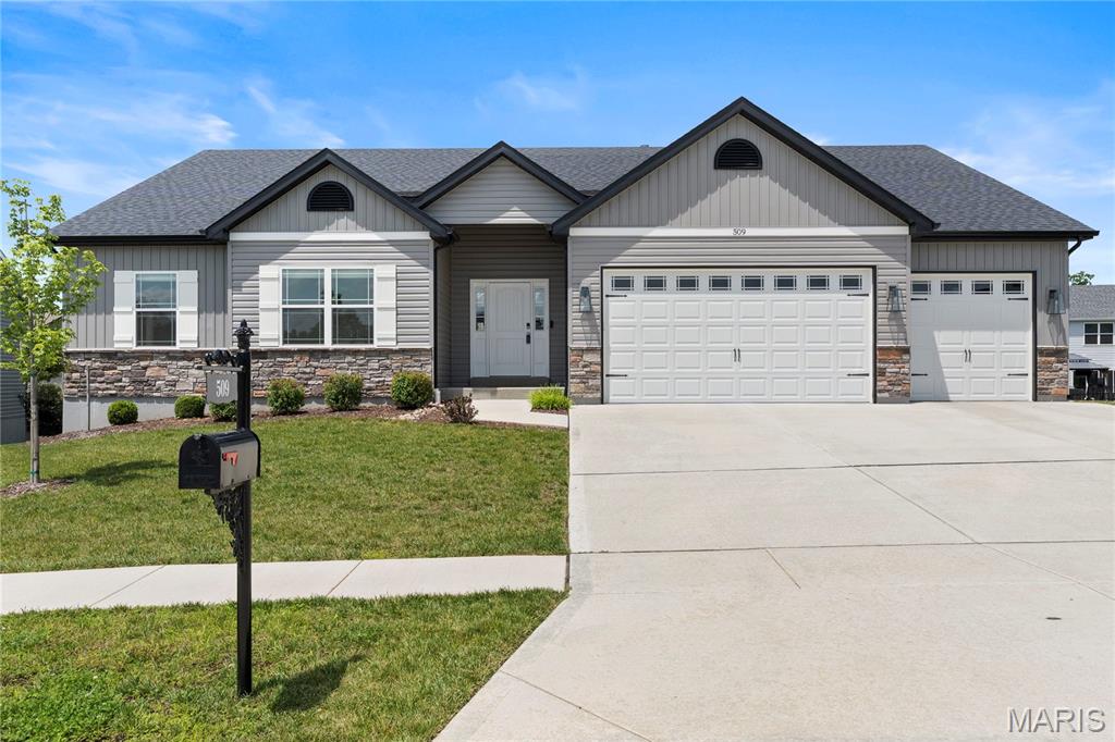 Looking for more space? High end luxury? Come see this stunning home with a 4 CAR GARAGE and over 3,000 sq.ft. of high end upgrades! Only 3 years old and ready for a Fast Closing! A grand entry leads to an impressive great room featuring upgraded flooring, soaring 12-foot ceilings, a wall of windows with transoms above, and abundant natural light, while 9-foot ceilings enhance the rest of the home. The dream kitchen boasts 42-inch upgraded white cabinetry, a massive white oak center island, a large walk-in pantry, and stainless steel appliances. Dining room/breakfast has a beautiful custom built butler pantry with beverage fridge. Main level has 3 large bedrooms including luxury primary with coffered ceiling and luxury bath with double vanities. The beautifully finished walkout lower level features a family room, recreation area, 4th bedroom and bathroom and a custom built vanity/closet dressing room. Situated on a large culdesac lot, this home offers luxurious upgrades throughout, including a fully sodded and landscaped yard, iron mailbox, fenced backyard perfect for kids or pets, a large maintenance-free deck, and an expansive patio for outdoor entertaining. Don't miss the oversized 4 CAR GARAGE, the third bay is two car tandum!! Why wait to build when your dream home is already complete and ready now? Fast closing available!