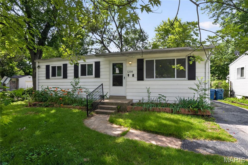 Charming 2-bedroom, 1-bath ranch located in the Larimore Hills subdivision of unincorporated St. Louis County. This single-family home provides 864 sq ft of living space on a level lot. Built in 1959, the property features a functional layout with a spacious living room, eat-in kitchen, and full basement providing additional storage or potential use. Convenient off-street parking and easy access to major highways, schools, and local amenities.