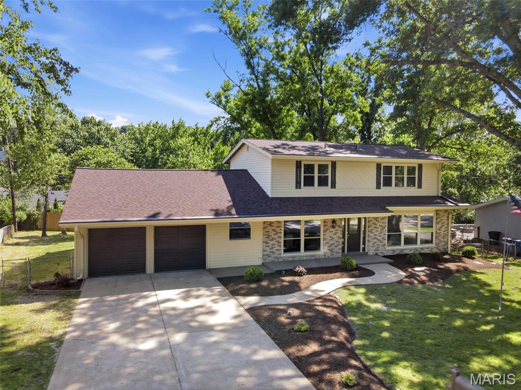 Showings begin June 4th! Welcome to your dream home! This beautifully renovated 2-story gem is packed with upgrades, including main floor laundry, a finished walkout lower level, and a spacious fenced backyard.

The chef’s kitchen features custom cabinetry, stunning quartzite countertops, tile backsplash, stainless steel appliances, gas cooktop with vented hood, a large prep/eating island, and access to a spacious deck—perfect for BBQs with family and friends.

The main level offers gorgeous wood floors, a formal dining room, cozy living room, family room with fireplace, and access to a second deck for even more outdoor enjoyment. Convenient main floor laundry includes storage cabinets and a folding area.

Upstairs, you’ll find wood floors, 4 generously sized bedrooms, and 2 updated full baths. The finished walkout lower level offers a rec room, dedicated office space, and additional living area to fit your lifestyle.

Step outside to a large, semi-private, gently sloping fenced backyard—ideal for relaxing or entertaining. Conveniently located near highways, shopping, restaurants, hospitals, and schools. Don’t miss your chance to call this beauty Home Sweet Home!
