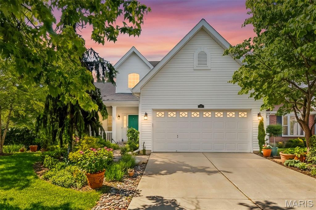 Welcome to 132 Towergate Drive in the highly sought-after Wyndgate Village subdivision in Lake St. Louis. This beautifully maintained 1.5-story home offers 3 bedrooms, 2.5 bathrooms, nearly 2,000 square feet of living space, a desirable corner lot location, and incredible curb appeal shaped by a master gardener’s intricate landscaping. From the carefully designed exterior to the peaceful backyard setting, this home offers charm inside and out.

Inside, you’ll find an inviting layout with a two-story entry foyer, a cozy living room fireplace, and a spacious loft that provides the perfect flex space for a home office, playroom, or additional sitting area. The kitchen offers plenty of cabinet and counter space, a pantry, and a functional layout that makes everyday living and entertaining easy.

Step outside to enjoy the composite deck overlooking the private backyard with mature landscaping, creating a beautiful outdoor space to relax or gather. The attached 2-car garage and full unfinished basement provide plenty of storage and future finishing potential.

Located in the award-winning Wentzville School District and just minutes from shopping, restaurants, parks, and major highways, this home combines comfort, convenience, and a standout location in one of Lake St. Louis's most desirable neighborhoods.