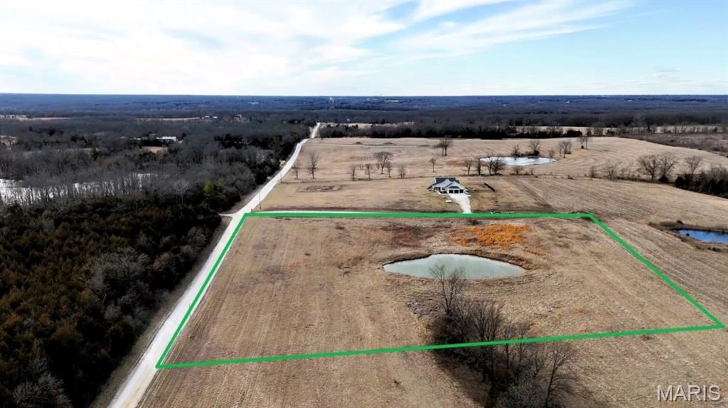 Looking for the perfect spot to build your dream home or investment property? This stunning 5.26-acre lot offers both privacy and convenience, making it an ideal location for your next project! Featuring a peaceful, private pond at the back of the property and county road frontage, this property offers plenty of space for your vision to come to life! Electric, water and fiber services at the road. Thoughtful building restrictions in place. Additional acreage available! Don’t miss out on this chance to own a beautiful piece of land with endless potential! Contact us today for more details or to schedule a viewing. Additional Rooms: Other
