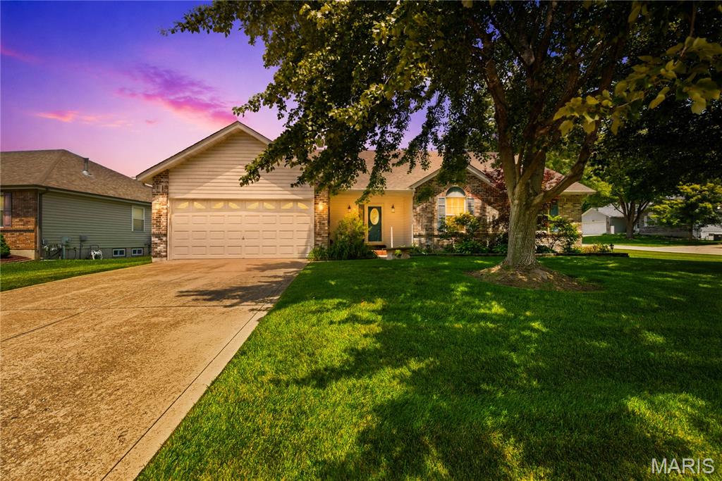 This spacious and open great room ranch home is conveniently located, close to restaurants, shopping, parks, and fantastic schools. Updates and upgrades galore with a bright and open feel! It features spacious bedrooms, open vaulted living space with fireplace, enclosed three season room, main floor laundry and upgraded gourmet kitchen! Special amenities include: wood floors, vaulted ceiling, updates to main floor bathrooms, custom cabinets, great room with fireplace,  recessed lights, three full bathrooms, sun room off the back make it bright and cozy! Kitchen upgraded custom cabinets with crown molding, granite counter tops, island and much more! Main floor primary bedroom with en-suite, large shower with built-in seat and walk in closet. Exterior features vinyl siding, enclosed soffits and fascia, oversized two car garage for storage, inground irrigation system, brick patio off back on a corner lot.  This beautiful home is gorgeously finished and sits in a very desirable community. The three season room adds living space not typically found in homes in the subdivision. Schedule your private showing today!