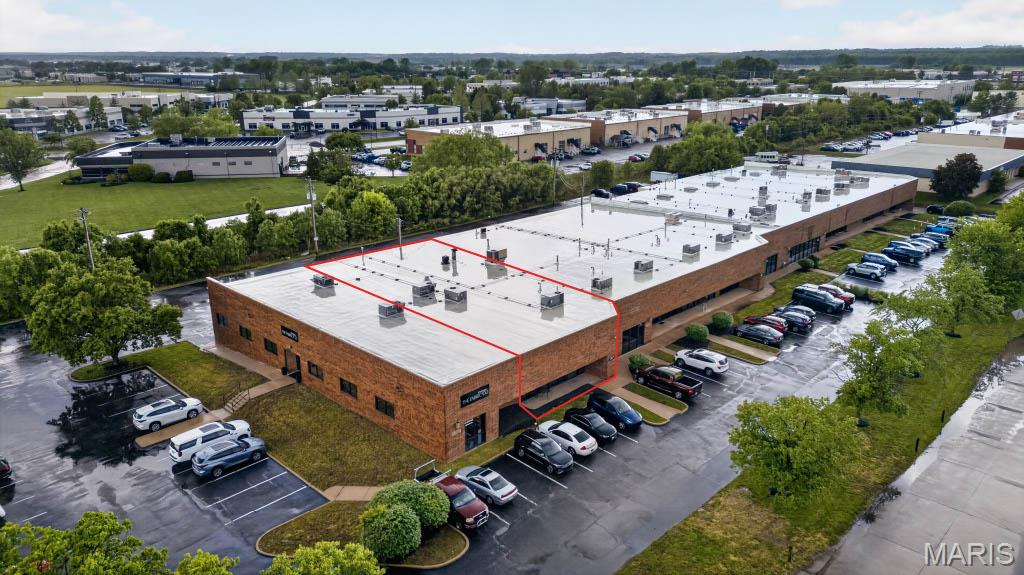 Located at 175 Chesterfield Industrial Blvd. in the Chesterfield Industrial park, this 2,752 square foot flex condominium offers an owner-occupant a rare opportunity to acquire a freestanding industrial unit in one of St. Louis County’s most active and accessible business corridors. The property sits within the Rockwood area/district with direct proximity to I-64, providing convenient access to both the regional highway network and the broader Chesterfield submarket.
The unit was built in 1989 and sits on a 0.0635-acre parcel zoned M-3. The building is single-story with 16’8? clear height to deck — a functional specification for a wide range of light industrial, warehouse, or flex users. The unit is fully sprinklered and currently features a concrete drive-in ramp that provides dock-high loading capability, accommodating freight movement without the need for a separate loading dock infrastructure. A window storefront provides street-facing visibility, making the space adaptable for uses requiring a customer-facing component alongside warehouse or shop operations.
The property is listed vacant and available in its entirety at 2,752 SF, priced at $459,000 ($166.78/SF). The 2025 assessed tax amount is $7,604. Construction status is existing, with no tenant in place — allowing an owner-user to take immediate occupancy upon closing.
Chesterfield Industrial is an established multi-tenant flex/industrial park with strong occupancy historically. The submarket benefits from its location along the I-64 corridor in west St. Louis County, with proximity to major retailers, service providers, and a dense daytime workforce population. The M-3 zoning designation accommodates a broad range of industrial and commercial uses.