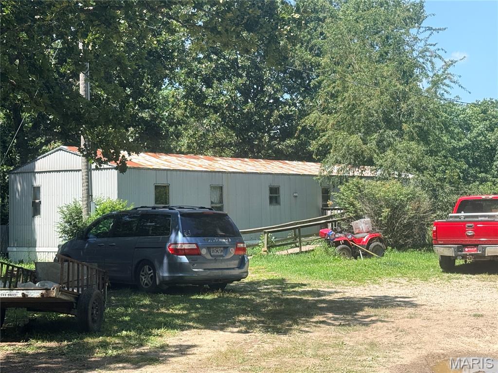 Opportunity awaits! Situated on 3.2 acres just minutes from town in the Salem R-80 School District, this 1996 3-bedroom, 2-bath single-wide manufactured home offers plenty of potential. The property is currently rented and is a HUD-approved rental, making it an excellent investment opportunity. Features include a private well, lagoon, and a 32x28 shop building built in 2000, providing ample space for storage, equipment, or hobbies. Being sold AS IS, this property offers tons of potential with a little cleanup and vision. Affordable acreage with room to make it your own or expand your investment portfolio!