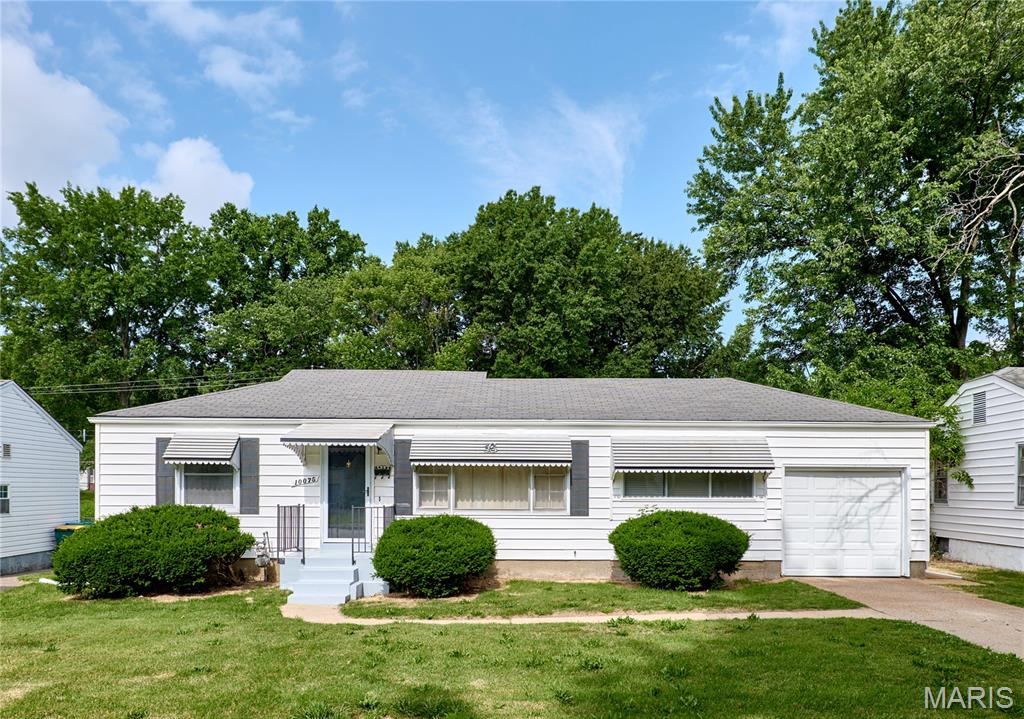 Fresh updates throughout this St. Louis, MO home! This 2-bedroom, 2-bath home features fresh paint, new flooring, and plenty of natural light. The living room flows into the kitchen and breakfast bar area, creating a functional layout for everyday living. The primary bedroom features fresh carpet and paint, while the second bedroom also has updated flooring and paint. One of the highlights of the home is the spacious sunroom with lots of windows. The lower level includes a second full bath along with additional space for storage, a family room, rec room, or other future finishes. Outside, you'll enjoy the brand-new deck overlooking the fenced backyard—perfect for pets, play, or entertaining. Additional updates include a beautifully renovated bathroom, new sliding glass door, new water heater, replaced main stack, and new tub. A nicely sized garage completes this move-in-ready home.