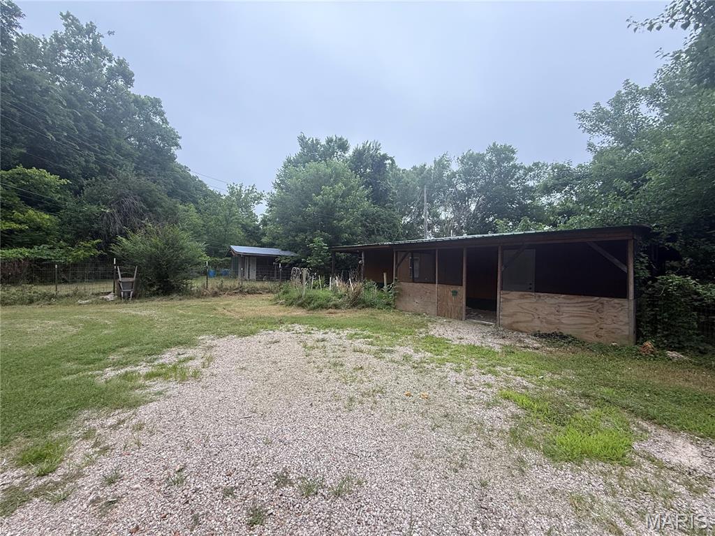 Quaint 1-bed (possibly 2), 1-bath trailer with detached shop. Great little getaway spot with a short drive to Clearwater Lake, making it the perfect relaxation haven!