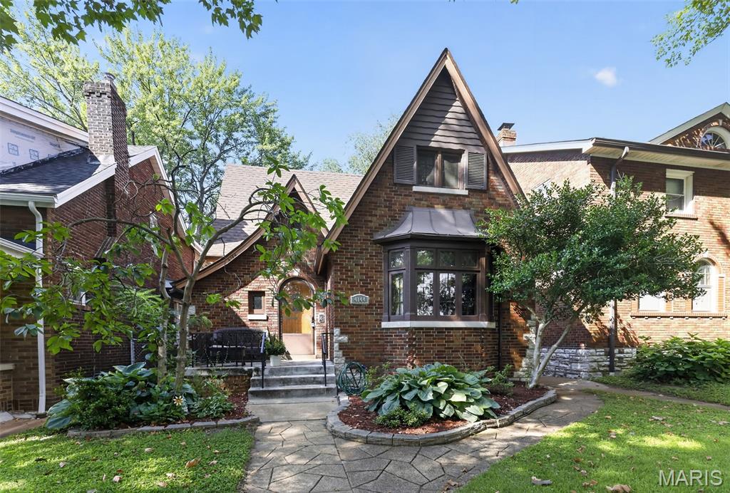 Welcome to 4144 Holly Hills Blvd., a classic Tudor in the heart of the highly sought-after Holly Hills neighborhood. Just steps from Carondelet Park, you'll enjoy easy access to walking and biking trails, tennis courts, playgrounds, the YMCA, fishing, and year-round community events. Everyday conveniences are just minutes away with grocery stores, restaurants, coffee shops, and shopping along the Loughborough corridor.
This beautifully maintained home blends timeless architectural character with thoughtful updates. From the moment you arrive, you'll appreciate the stunning brick exterior, steep-pitched rooflines, and inviting curb appeal. Inside, original hardwood floors, stained glass windows, rich wood trim, arched doorways, and a beautiful wood-burning fireplace showcase the craftsmanship that makes Tudor homes so desirable.
The spacious living room flows into a formal dining room, creating an ideal layout for entertaining. The updated upper-level primary suite is a true retreat, featuring a spa-inspired bathroom with a soaking tub, oversized walk-in shower, custom live-edge vanity, and a generous walk-in closet. Additional bedrooms offer plenty of space for family, guests, or a home office.
Major updates include a new roof installed in 2024 and zoned air conditioning, providing enhanced comfort and efficiency throughout the home.
Whether you're relaxing at home, entertaining friends, or taking a short walk to one of St. Louis' most beloved parks, this home offers the perfect combination of historic charm, modern convenience, and an unbeatable location. Don't miss your opportunity to own a piece of Holly Hills in one of South St. Louis' most desirable neighborhoods.