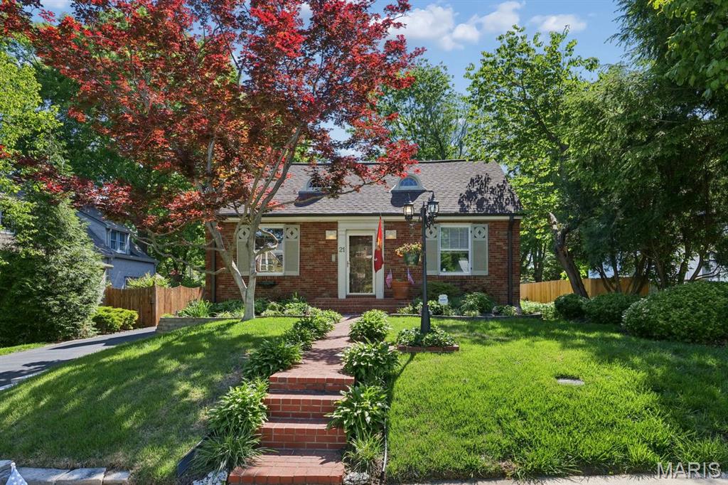 Nestled in the heart of Glendale, there is so much to love in this classic, expanded 1930s ranch!  Terrific curb appeal and lush plantings greet you at the street.  Step inside and be charmed by the pretty Living Room with beautiful stained glass windows flanking the fireplace (sold as-is). The coved ceiling and hardwood floor flows seamlessly to the Dining Room, featuring a lighted, built-in corner cabinet.  The Kitchen has granite counters, white cabinets, gas range/oven, microwave, dishwasher and disposal, as well as a pantry cabinet and extra closet.  The breakfast bar offers a wonderful transition to the Family Room, making this area the heart of the home, and perfect for entertaining or family hang outs!  The Family Room boasts a half vaulted ceiling with a gas fireplace, mantel and marble hearth as the focal point of the room.  There are also built-in cabinets with bookshelves and twin French doors leading to the maintenance-free deck.  A side door, ceiling fan and newer carpeting complete the room.  The other half of the vaulted ceiling is in the Primary Bedroom Suite, with ceiling fan, plenty of closets and an attached full Bathroom.  Two additional Bedrooms and a Hall Bathroom offer more stained glass windows, and there are two more closets in the Back Hall.  There is a one car detached garage and plenty of additional off street parking.  Enjoy all the fun community activities Glendale offers and Kirkwood Schools.  Eight and 1/2 foot ceilings throughout, new HVAC system in 2023 and Roof in 2019.  ADDED BONUS: Approximately $160,000 assumable VA loan is available to qualified Buyers.  Seller prefers an as-is sale.