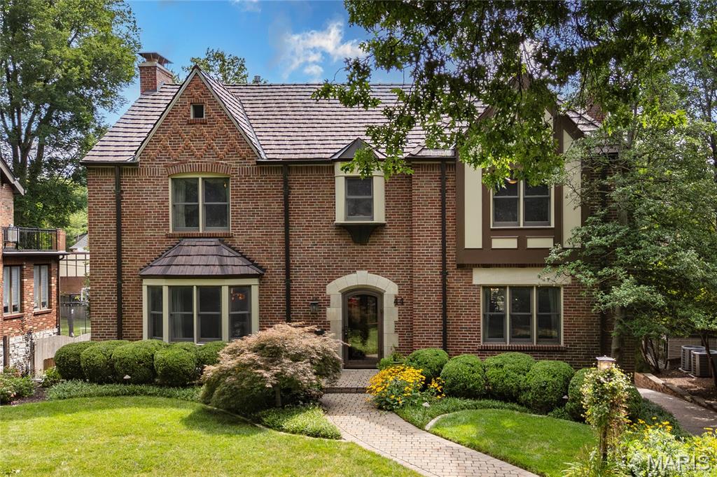 Stunning 2-Story showplace situated on picturesque .28-acre lot in the prestigious Claverach Park neighborhood - Top Rated Clayton Schools. This 5 bedroom - 4 full & 1 half bath home boasts a one-of-a-kind architecturally stunning, open floor plan, designed for today’s living and entertaining, featuring over 6,000 square feet, including the finished lower-level, custom luxury finishes and high-end amenities throughout. 

Walk through the handcrafted front door, into the entry foyer with marble floors, and you will know you are home. Main floor features a formal living room with gorgeous fireplace, and a large, formal dining room, both with exceptional period moldings. 

The gourmet eat-in kitchen is a chef’s dream with custom cherry cabinetry, granite counters, Wolf, Miele and SubZero stainless appliances, Butler’s pantry with 130 bottle wine cooler, and opens to the light filled breakfast room, and a spectacular family room with 10’ wood beamed ceiling, maple hardwood floors, custom built-in entertainment center & work area, with surround sound. 

Upstairs you will find an incredible master retreat with 18’ vaulted ceiling, his & her walk-in closets, sitting room, workout room and laundry room and luxurious master bath with steam shower, double whirlpool tub, his & her sinks, make-up area, commode & bidet, marble floors and built-in speakers, and its own private, custom spiral staircase to the main floor. You will also find 4 more spacious bedrooms and 2 additional full baths, on the 2nd floor. 

Finished lower-level features gas stone fireplace and full bath. Other features include a 2-car oversized garage & stand-alone 1-car garage, home audio system, zoned heater & cooling, Marvin windows and mudroom with dog shower, just to name a few. Relax outside on the upstairs covered deck or on the outdoor living area below, with fireplace and enjoy the beautifully landscaped private backyard that is a gardener’s paradise. This house is perfect for entertaining family & friends. 

Location could not be better – a 5-min walk to downtown Clayton restaurants, coffee shops, galleries, art fair and a 10-minute drive to Washington University, Barnes-Jewish Hospital, Forest Park, and the Delmar Loop. Easy access to major highways, and St. Louis Lambert International Airport!