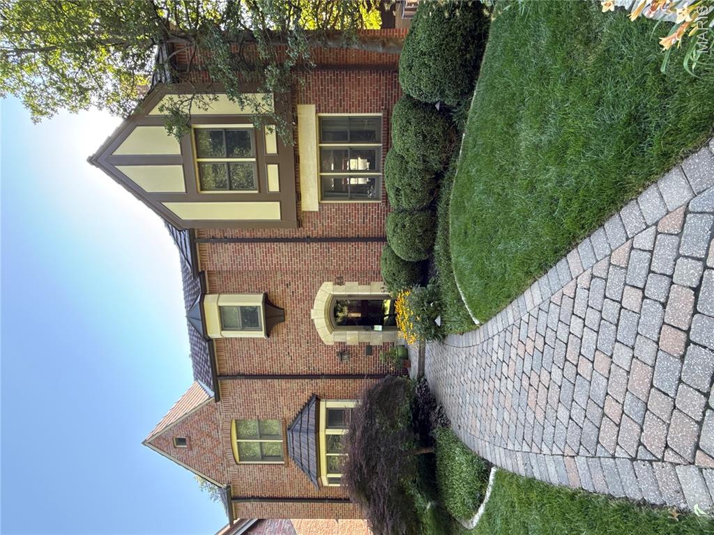 Stunning 2-Story showplace situated on picturesque .28-acre lot in the prestigious Claverach Park neighborhood - Top Rated Clayton Schools. This 5 bedroom - 4 full & 1 half bath home boasts a one-of-a-kind architecturally stunning, open floor plan, designed for today’s living and entertaining, featuring over 6,000 square feet, including the finished lower-level, custom luxury finishes and high-end amenities throughout. 

Walk through the handcrafted front door, into the entry foyer with marble floors, and you will know you are home. Main floor features a formal living room with gorgeous fireplace, and a large, formal dining room, both with exceptional period moldings. 

The gourmet eat-in kitchen is a chef’s dream with custom cherry cabinetry, granite counters, Wolf, Miele and SubZero stainless appliances, Butler’s pantry with 130 bottle wine cooler, and opens to the light filled breakfast room, and a spectacular family room with 10’ wood beamed ceiling, maple hardwood floors, custom built-in entertainment center & work area, with surround sound. 

Upstairs you will find an incredible master retreat with 18’ vaulted ceiling, his & her walk-in closets, sitting room, workout room and laundry room and luxurious master bath with steam shower, double whirlpool tub, his & her sinks, make-up area, commode & bidet, marble floors and built-in speakers, and its own private, custom spiral staircase to the main floor. You will also find 4 more spacious bedrooms and 2 additional full baths, on the 2nd floor. 

Finished lower-level features gas stone fireplace and full bath. Other features include a 2-car oversized garage & stand-alone 1-car garage, home audio system, zoned heater & cooling, Marvin windows and mudroom with dog shower, just to name a few. Relax outside on the upstairs covered deck or on the outdoor living area below, with fireplace and enjoy the beautifully landscaped private backyard that is a gardener’s paradise. This house is perfect for entertaining family & friends. 

Location could not be better – a 5-min walk to downtown Clayton restaurants, coffee shops, galleries, art fair and a 10-minute drive to Washington University, Barnes-Jewish Hospital, Forest Park, and the Delmar Loop. Easy access to major highways, and St. Louis Lambert International Airport!