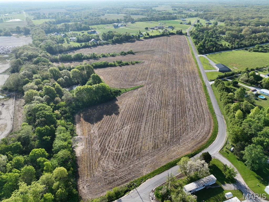Discover the possibilities with this beautiful 13+/- acre tract located in desirable Lincoln County, just one mile west of Troy on the south side of Highway 47. Featuring gentle, rolling topography and primarily open ground, this versatile property offers an ideal setting for a variety of uses including agricultural pursuits, recreational enjoyment, building your dream home, or future development opportunities. With electric and public water available along the road frontage, the groundwork is already in place to make your vision a reality. The mostly open acreage provides ample usable land for farming, livestock, hobby farming, or creating a private country retreat. Conveniently located near Troy with easy access to Highway 47, this property combines the tranquility of rural living with the convenience of nearby amenities. Whether you're looking to invest in land, expand your agricultural operation, establish a homestead, or explore development potential, this exceptional acreage offers endless possibilities in a highly desirable location. Don't miss this opportunity to own a prime piece of Lincoln County countryside.