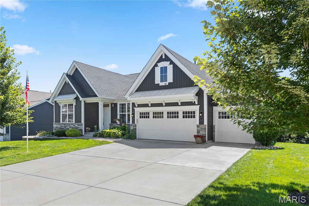 Let's start with the backyard! Instead of another row of homes, yours opens to 35 peaceful acres of Deer Ridge Nature Park, complete with walking trails, a scenic pond, and the kind of privacy that's becoming harder to find. Now let's talk about the house! Built in 2019 and offering 2,554 square feet of thoughtfully designed living space, this beautifully maintained ranch sits on a generous .66-acre lot and blends modern style with everyday comfort. From the moment you step inside, the soaring 12-foot great room ceilings and open-concept design create a bright, welcoming space that instantly feels like home. The gourmet kitchen was designed for gathering—not just cooking. Quartz countertops, a large center island with breakfast bar, walk-in pantry, stainless steel appliances, double ovens, and a gas cooktop make it as functional as it is beautiful, while the adjoining great room keeps everyone connected, whether you're entertaining a crowd or enjoying a quiet evening at home. The main level offers three spacious bedrooms, a private office just off the foyer, two full baths, a guest half bath, main-floor laundry, and a convenient mudroom off the garage. At day's end, retreat to the spacious primary suite featuring a custom-tiled dual walk-in shower, generous walk-in closet, and plenty of room to relax and recharge. Need room to grow? The finished walkout lower level already includes an additional bedroom and full bath, while the expansive unfinished space with 9-foot poured foundation walls is ready for a media room, fitness area, workshop, or exceptional storage—whatever fits your lifestyle best. Lower level movie projector and 9 x 11' movie screen will remain. Step outside and you'll understand why this home feels like a retreat. Enjoy your morning coffee on the patio, unwind in the included hot tub after a long day, gather around the fire pit with family and friends, or simply take in the peaceful wooded backdrop. Here, nature isn't just nearby—it's part of everyday life. The oversized three-car garage with tandem fourth-car bay, epoxy-coated floor, and 240-volt EV charging outlet offers incredible flexibility for extra vehicles, hobbies, and storage. Additional highlights include luxury vinyl plank flooring, an irrigation system, invisible pet fence, professionally installed & programmable Trim lights, and Ring doorbell/security cameras that will remain with the home. And the lifestyle extends well beyond your property line. Lake Saint Louis Community Center privileges are included! You'll enjoy coveted lake privileges, beaches, swimming pools, clubhouse, golf, tennis and pickleball courts, dining, and year-round community events. Privacy. Space. Nature. Community. This isn't simply a beautiful home—it's a place to slow down, spread out, and enjoy the lifestyle you've been looking for.