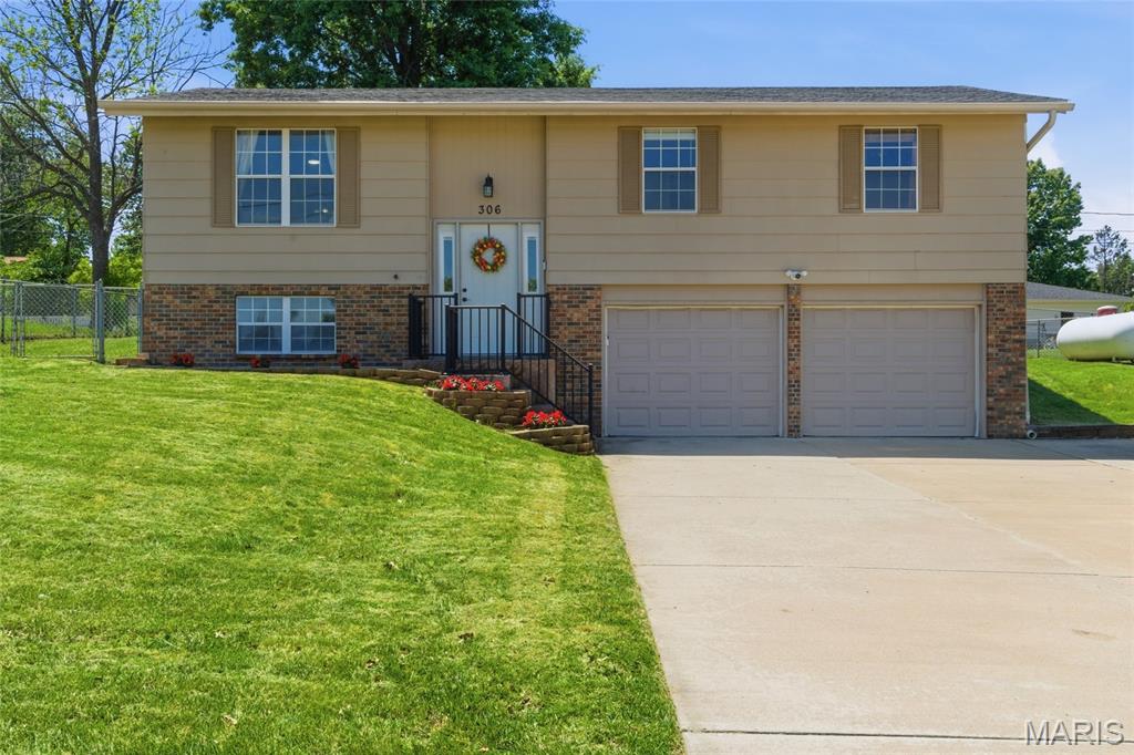 Showings begin on Fri 5/15. Welcome to this newly updated split-foyer, with 3 beds and 2.5 baths. The heart of this home is its open-plan main floor, seamlessly integrating the kitchen and dining room with the living room. It features newer sleek stainless steel appliances and sophisticated stone-look counters, complemented by a practical peninsula that invites casual gatherings and culinary exploration. The island area is also perfect for a cute coffee nook. The finished LL offers a large family room, with a half bath and laundry. Beyond the interior, a large level fenced yard offers an idyllic setting for relaxation and entertainment. Enjoy al fresco meals in the dedicated outdoor dining area, or unwind on the huge covered patio, perfect for year-round enjoyment. The two sheds are great for extra storage, and offer electric. The garage features a built-in workbench area and an extra fridge. With an excellent central location, also in an award-winning school disctrict, this property is a testament to comfortable, stylish living, ready to inspire your next chapter.
TONS OF UPGRADES: New Roof including on sheds (2025); Rain Gutters; Newer flooring throughout; Kitchen remodel; tons of fresh paint; new bathroom in LL, and more!