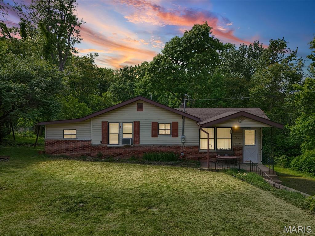 Opportunity awaits with this ranch home tucked away on the outskirts of Arnold, MO, set on nearly an acre with a sprawling front yard and a private backyard backing to mature woods. This property offers incredible potential in a highly desirable area, making it a standout opportunity for investors or buyers looking to build equity.
Inside, you’ll find a spacious living room filled with natural light that flows into a generously sized kitchen with ample cabinet storage and room to create a modern open-concept design. The home features 2 bedrooms and 1 full bathroom, offering a solid foundation for renovation or rental potential. Original woodwork, functional living spaces, and a flexible layout add to the home’s character and possibilities. Seller had home appraised in March. Home is listed under appraised value. 
The lower level provides additional space for storage or future finishing. While updates are needed, the home’s strong footprint and setting make it an ideal project for investors, flippers, or anyone ready to bring their vision to life.