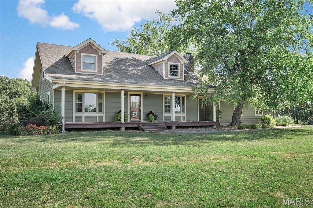 Story-and-a-half log construction home situated on approximately 3 acres in great location with Highway 70 frontage. This 3 bedroom, 2 bath home offers two spacious bedrooms on the main level and one upstairs bedroom suite with sitting room / balcony overlooking the main living area. The living room features a floor to ceiling stone fireplace and is open to the kitchen / breakfast area.
The home has a full basement with office area for additional space and storage.
 A two car attached garage with a breezeway provides convenient access into the home. (Could add main floor laundry in the breezeway area)
Enjoy outdoor living from the rear deck overlooking the open, useable acreage
The property provides ample space for residential use and flexibility for other potential uses - Convenient location with excellent visibility and access. A Unique opportunity for buyers seeking land, character and location.