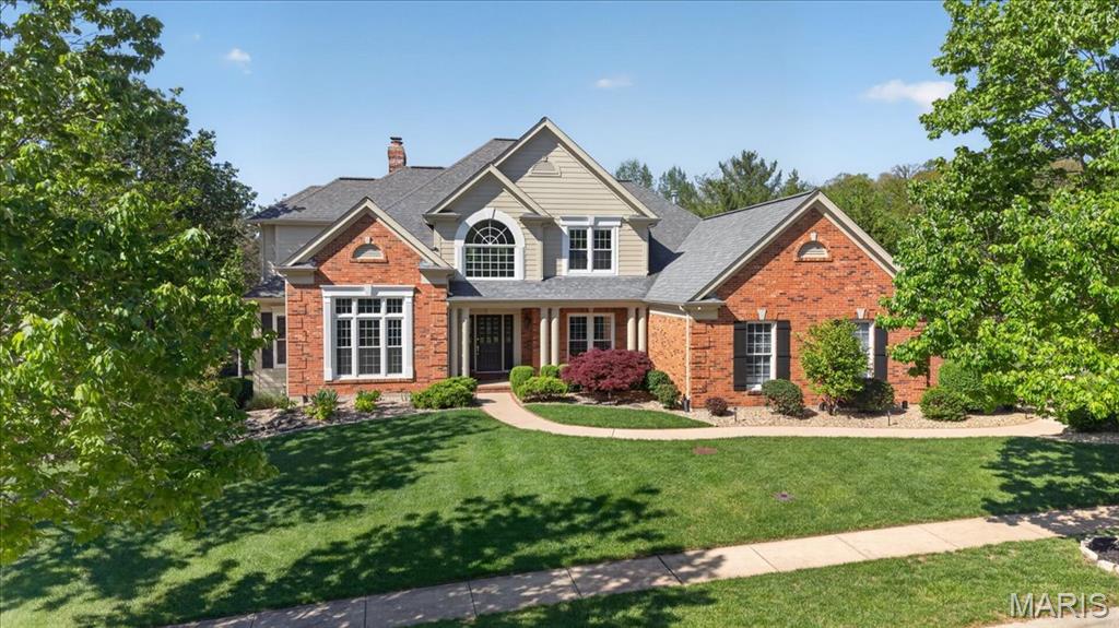 367 Pine Bend is a Miceli-built custom 1.5-story set on a premier 0.7-acre lot in the coveted Pine Creek neighborhood. Meticulously maintained and thoughtfully designed, this home delivers the kind of size, setting, and layout buyers rarely find together off of Wildhorse Creek Road. The main level features a dramatic two-story great room, private home office, traditional dining room, spacious primary suite, and a large updated kitchen with premium granite countertops, stainless steel appliances, generous island, double oven, five-burner gas range, and a seamless connection to the vaulted hearth room with a floor-to-ceiling stone fireplace. The primary suite offers vaulted ceilings, arched windows, two walk-in closets with custom shelving, a double vanity with ample counter space, and a separate water closet. Upstairs, three oversized bedrooms each include walk-in closets, with one featuring a private en-suite bath and two connected by a Jack-and-Jill. The walkout lower level is built for flexibility, offering the perfect setup for guests, entertaining, or multigenerational living with a full bar, bedroom with private patio access, full bath, another stone fireplace, and generous storage. Outside, the landscaping is second to none, with vibrant plantings surrounding the home, a three-car side-entry garage, and a wraparound deck that makes entertaining effortless. Located in the award-winning Rockwood School District and just minutes from Chesterfield Valley and Highway 64, 367 Pine Bend offers an unmatched combination of presence, function, and value.