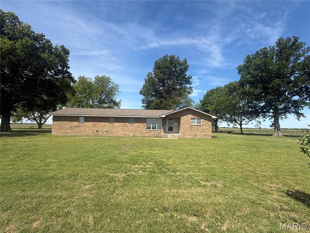 Country Living with 2 Acres More or Less!  Located between Kennett and Caruthersville. Outside of Deering and Steele MO. Close to Hwy 164 and Hwy 412,  for driving to Blytheville, Osceola, Paragould, Caruthersville, or Kennett to work. 30 Minutes to most work areas in the Southeast MO Bootheel and Northeast Arkansas. This home offers 3 bedrooms, 2 baths. The master bedroom has a large walk in closet and ensuite bathroom. Split floor plan. Living room, family room or dining room, and a laundry room. Bonus is a walk in safe room. The yard is an amazing size! So much room for work and play! Lot Size 2.13 Acres +/-