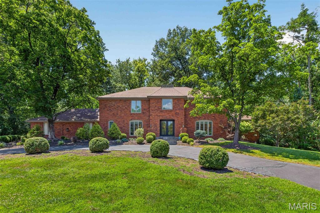 Showings begin Friday, July 10th.

Gracefully nestled on more than 1.5 private acres, this timeless brick classic was thoughtfully reimagined in 2021, offering exceptional design, and an atmosphere of quiet elegance and retreat. 

A dramatic two-story reception hall with a sweeping staircase unites formal and casual living spaces, designed for elevated entertaining and everyday comfort. At the heart of the home, the vaulted great room showcases soaring timber-beamed ceilings, a handsome fireplace, wet bar, and French doors that open to a series of tranquil courtyards. The beautifully updated kitchen boasts Sub-Zero and Viking appliances, quartz countertops, a breakfast room, and opens to a laundry/mud room, attached garage, and an expansive patio. The main-level primary suite features a custom walk-in dressing room and a luxury new bath with dual vanities, a jetted soaking tub, and separate shower. 

Upstairs, four generously sized bedrooms are complemented by two beautifully appointed bathrooms. The expansive lower level presents excellent potential for recreation, wellness, or additional living space tailored to your lifestyle. 

Surrounded by mature trees, the grounds provide a wonderful retreat and leisurely walks to the neighborhood lake continue the peaceful connection to nature. Conveniently located near premier schools, hospitals, shopping, dining, and everyday conveniences, this is a rare offering that seamlessly blends timeless architecture with modern luxury and private seclusion.