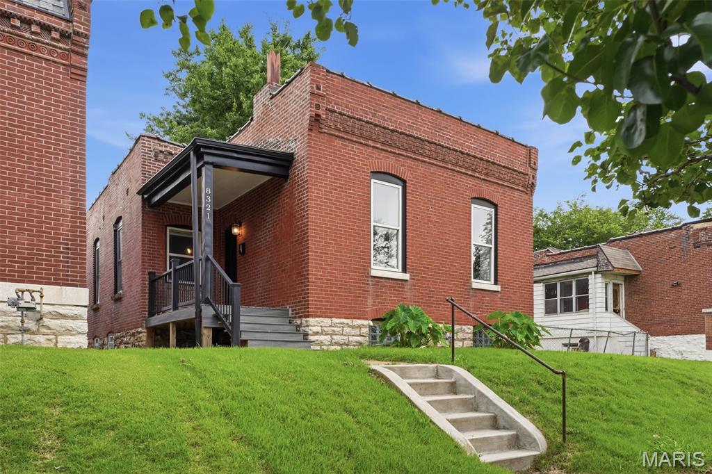 Welcome home to this beautifully renovated South St. Louis brick gem! This fully updated, move-in-ready home blends historic character with modern upgrades, giving you the charm of classic architecture without the maintenance concerns of an older property. Featuring an open-concept layout with soaring ceilings, exposed brick accents, and abundant natural light, this home offers a warm, inviting atmosphere perfect for everyday living and entertaining.

The modern kitchen features shaker cabinetry, granite countertops, and stainless steel appliances, creating a stylish and functional space. Major improvements include the roof, plumbing, electrical, flooring, windows, doors, and more.

Enjoy relaxing mornings on the covered composite porch, or step outside to the backyard, where a low-maintenance composite deck and plenty of yard await. Also, you'll find a parking pad in the rear of the home with space for multiple vehicles - a valuable feature for city living. 

Conveniently located near local restaurants, parks, shopping, and downtown St. Louis attractions, this property offers comfort, convenience, and modern living in South St. Louis.