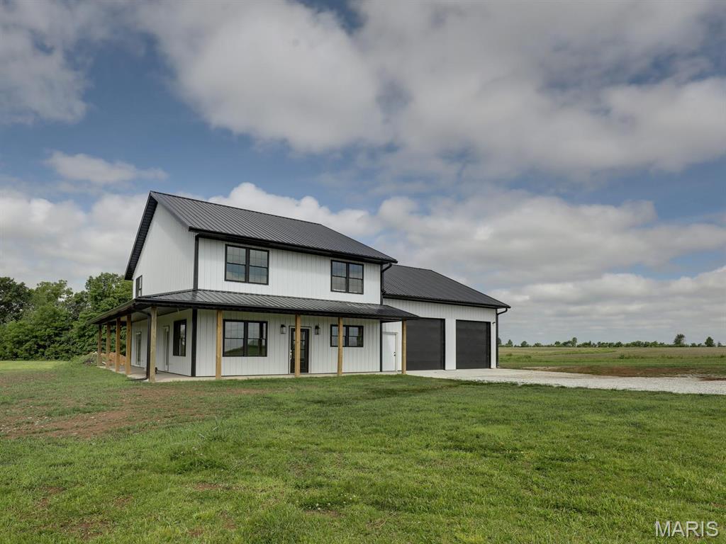Thoughtfully designed and beautifully crafted, this brand-new modern barndominium offers the perfect balance of style, comfort, and space on 3.5 acres in the Monroe City School District. Featuring 4 bedrooms, 2.5 baths, and an open-concept layout with contemporary finishes throughout, the home is ideal for both everyday living and entertaining. The impressive 40x30 attached garage/shop includes its own bathroom, providing exceptional flexibility for vehicles, storage, hobbies, or a workshop. Enjoy the privacy and freedom of acreage living while remaining conveniently close to town—and unlike neighboring properties, this home is not part of the nearby subdivision. A rare opportunity to own a distinctive new-construction home with modern appeal and room to grow.