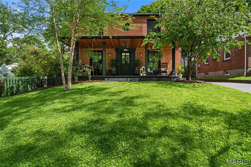 Est. 1954.  Completely renovated and impeccably maintained, this stunning 4 bedroom, 4.5 bath brick Colonial is located on one of Webster Groves's most favorite streets. Blending timeless architecture with sophisticated modern updates, this exceptional home offers the perfect combination of character, comfort, and functionality. From the moment you arrive, the curb appeal is undeniable with a beautifully maintained brick exterior, upgraded front porch with heaters, stamped concrete driveway, professional landscaping, and detached 2-car garage. Inside, rich hardwood floors flow throughout the home, creating warmth and continuity across every level. Natural light fills the spacious living areas, enhancing the home’s inviting and elegant atmosphere. The renovated kitchen is truly the centerpiece of the home, thoughtfully designed for both everyday living and entertaining. Features include a massive center island, custom cabinetry, copper sink, gas cooktop, quality finishes, and abundant prep and storage space. The adjoining living space offers effortless flow and timeless style. The luxurious primary suite serves as a private retreat with heated brick flooring and beautifully updated bath spaces. Upstairs also includes a second laundry area and an added ensuite bath, providing convenience and flexibility. Outdoor living is equally impressive with a remodeled enclosed sunroom, newly added patio, gas fire pit, and fully fenced backyard designed for relaxation and entertaining. Some of the extensive updates include privacy fence, enclosed sunroom remodel and new patio/fire pit, Daikon mini splits in upstairs bedrooms to supplement the AC, heated brick flooring in primary bedroom, second upstairs laundry, stamped concrete driveway and porch, roof, and tie wall, and Anderson windows. This is a rare opportunity to own a truly move-in ready home in one of Webster Groves’ most loved neighborhoods, close to schools, restaurants, shops and dining. Don't miss this one!