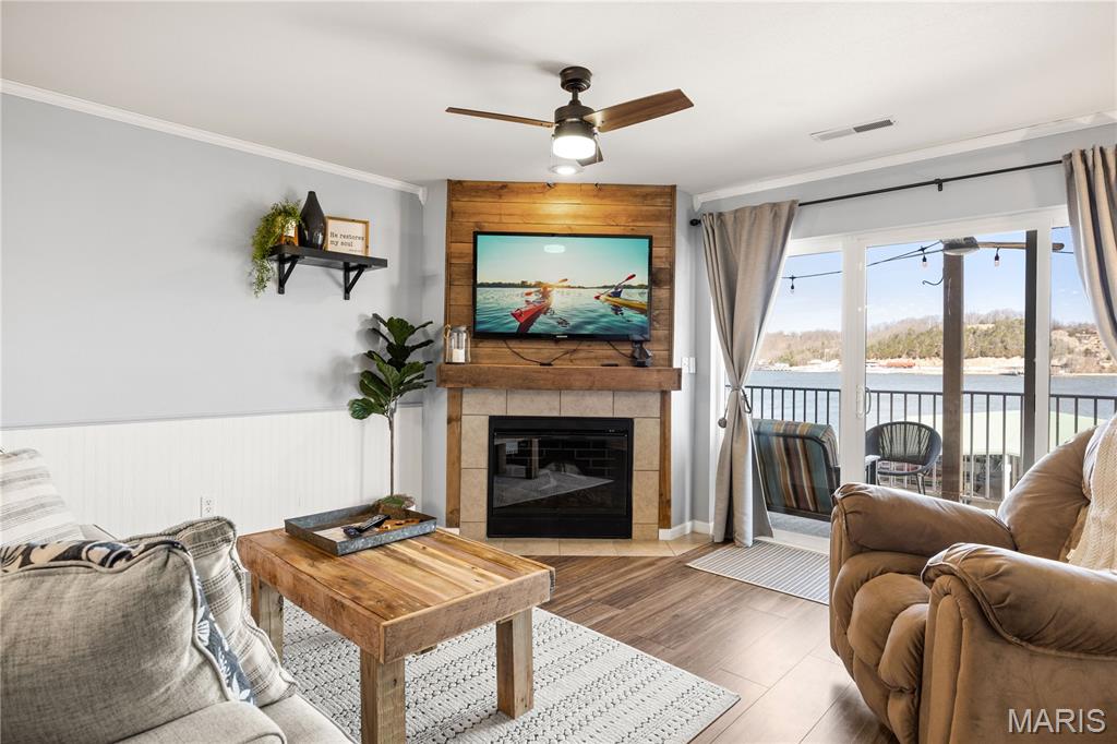 Fully furnished with boat slip & garage. Experience lakefront living at its finest with this polished, turnkey 2-BR/2-BA condo at Miramar Condominiums. Situated at the 2MM of the Big Niangua, this unit offers the ultimate convenience—nearly a walk-in experience with only eight steps to your front door. This "full package" listing is designed for the effortless lake lifestyle, featuring a private boat slip, Hydro Hoist, and a rare garage. The dock slip is positioned directly in front of the unit, allowing you to keep a watchful eye on your vessel from the comfort of home. Located in an intimate complex, Miramar offers a perfect balance: vacation rentals are permitted, yet a strong community of full-time residents fosters a quiet, family-friendly atmosphere. Enjoy days at the lakefront pool or take advantage of the easy-access common areas. With expansive panoramas of the Big Niangua, iconic bridge views, and ample guest parking, this meticulously maintained property is move-in ready. Whether seeking a full-time residence or a high-end retreat, this property delivers on every front. Come take a look—this is the one you’ve been waiting for!