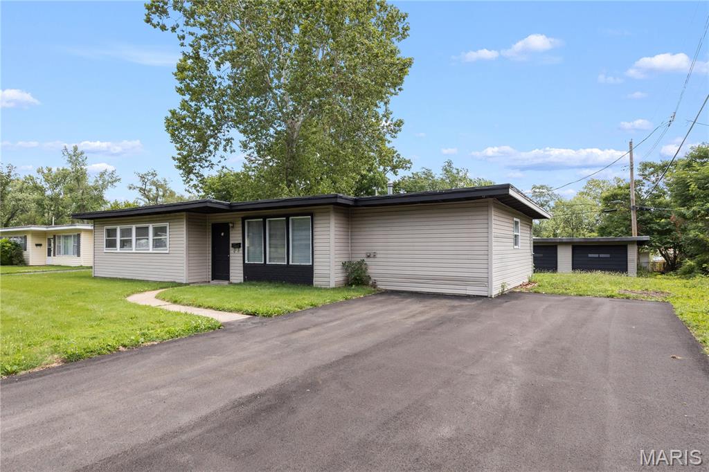 Welcome to 49 Marquette Dr in Florissant! This well-maintained home offers great updates and excellent convenience in a centrally located area just off Lindbergh, close to shopping, restaurants, and everyday amenities. Recent improvements include new flooring, updated driveway, 100-amp electrical panel, A/C, and much more. The property features a spacious layout, a very large backyard perfect for entertaining, pets, or outdoor enjoyment, plus a 2-car garage for parking and storage. FHA and VA buyers are welcome. A great opportunity for an owner-occupant or investor looking for a solid home in a convenient Florissant location!
