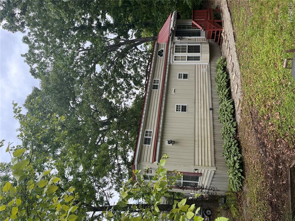 Enjoy affordable lake community living in Goose Creek Lake! This charming tiny home offers the perfect weekend getaway or low-maintenance retreat with access to boating, fishing, swimming, and all the amenities the community has to offer. Situated on a level lot with covered parking and additional storage, this property is move-in ready and ideal for relaxing summer weekends or year-round enjoyment. conveniently located near community recreation areas, pool, beach access, and boat ramp. All furnishings are included in the sale, making this a truly turn-key opportunity. The neighboring twin property is also available for purchase, offering a unique opportunity for additional space, expanded use, or potential investment property used as a rental property. the possibilities are endless!!