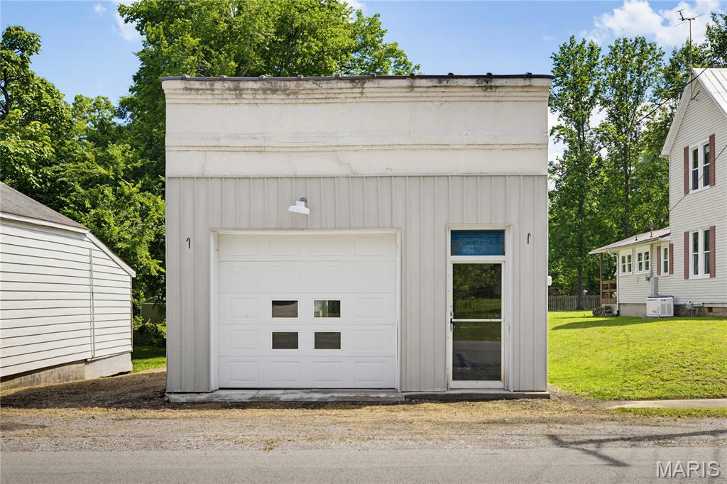 Rich in local history, this property previously housed the Bank of Gordonville, Cape State Bank, and the Gordonville USPS office. The inside has exposed brick walls and the original vault with decorative historic detail adding to its charm.
