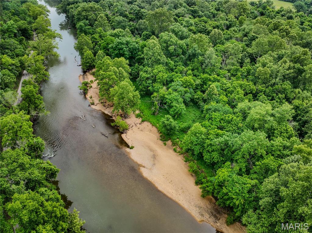 Own Your Own Beach on the Meramec River

How many people can say they own their own beach? This 1-acre recreational lot in Cuba, MO gives you that rare opportunity on the Meramec River, with a comfortable usable beach for fishing, floating, camping, and relaxing by the water. Enjoy sunny and shaded spots, river frontage, a flat camp area behind the beach, and woods beyond. Imagine landing your kayak, fishing from shore, camping for the weekend, and watching floaters drift by on one of Missouri’s favorite rivers. Access to the main beach area is by water only. The easiest access is nearby public Riverview Access, where you can park and launch, then float roughly one minute north around the bend to your beach. Deeded beach frontage is part of a larger roughly 350-foot beach setting, about the length of a football field, with adjoining public conservation land creating the feel of a larger river escape. No known restrictions. Monthly payment options may be available with acceptable terms