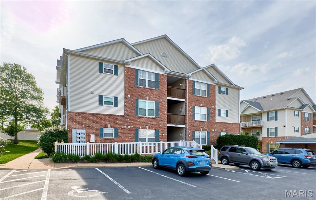 Welcome to your charming two-bedroom, two-bath condo in the highly sought-after Grantwood Place Condos, located in close proximity to Grants Farm and Whitecliff Park.  Step inside to this open concept condo with vaulted ceilings that create an airy, open feel. The primary en-suite is well appointed and includes a large walk-in closet.  The updated kitchen boasts sleek stainless-steel appliances, perfect for any home chef. Enjoy the convenience of an in-unit full-size laundry room and relax on your covered north-facing deck complete with a storm door. Additionally, you’ll have your own designated covered carport—space number 11—and a first-level storage unit. This is low-maintenance, comfortable living at its best!  Refrigerator, washer and dryer are included for even more convenience.