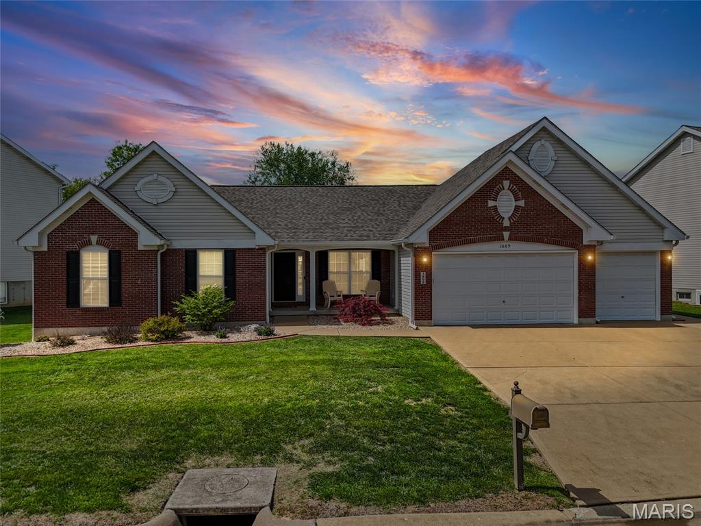 Welcome to Bailey Station—where comfort, character, and convenience come together in one stunning Festus home. Nestled on a quiet street framed by cul-de-sacs on both ends, this beautiful ranch offers the perfect blend of peaceful living and close-to-everything convenience.  Step inside and immediately feel the impact of the extended vaulted ceilings that flow seamlessly from the kitchen into the living room, creating an open and inviting atmosphere. The showstopping see-through fireplace features custom floor-to-ceiling stonework and built-in bookshelves that add warmth, elegance, and personality to the heart of the home. You’ll love the thoughtful architectural details throughout—from arched doorways to crown-molded kitchen cabinetry—along with an impressive walk-in pantry and spacious laundry room designed for everyday functionality. The main level features 3 bedrooms and 2 full bathrooms, including a comfortable primary suite built for relaxation. Need space? This home delivers. The oversized 3-car garage offers plenty of room for vehicles, storage, or hobbies, while the unfinished basement is truly a rare find—measuring approximately 60 feet long by 43 feet wide, giving you endless possibilities for future living space, recreation, storage, or customization. Out back, enjoy your own private oasis with privacy fencing and a covered patio perfect for relaxing evenings, entertaining guests, or quiet mornings with coffee. Located just minutes from everything Festus has to offer—parks, shopping, dining, schools, and easy highway access—this Bailey Station beauty combines style, space, and location in one unforgettable package.