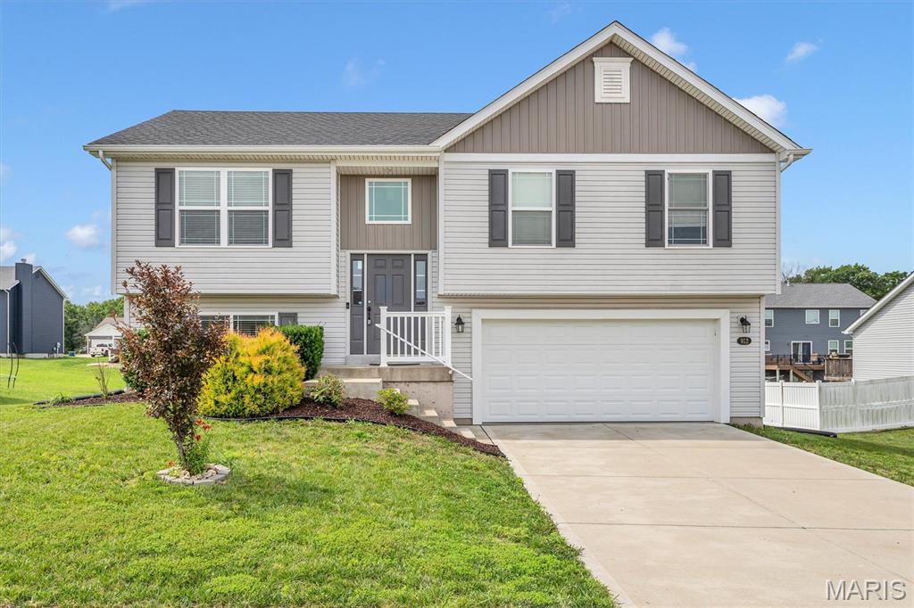 Move-in ready and built in 2019, this beautiful split-foyer home offers 3 bedrooms, 2 full baths, and modern finishes throughout. The stunning kitchen features gray shaker cabinetry, granite countertops, stainless steel appliances, a built-in microwave, and a center island with bar seating. Luxury vinyl plank flooring flows through the kitchen, breakfast area, and family room, creating a stylish and low-maintenance living space. The spacious primary suite includes a private full bath, while a second full bath conveniently serves the additional bedrooms. The unfinished basement has already been roughed in for a third full bath, providing endless possibilities for future expansion, including a recreation room, home office, gym, or additional living area. You'll also appreciate the oversized garage, offering plenty of room for vehicles, storage, and hobbies. Situated in a quiet, newer subdivision, this home is conveniently located near shopping, dining, schools, and everyday amenities. Don't miss the opportunity to own this like-new home in a desirable location!