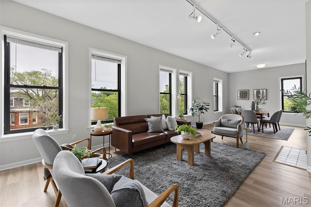 Enjoy exceptional space and style in this beautifully updated 3-bedroom, 2-bath condo located in the heart of the Central West End! Filled with natural light, the expansive living and family room features a cozy fireplace and an abundance of windows that create a warm and inviting atmosphere. The updated kitchen offers custom cabinetry, granite countertops, and plenty of space for cooking and entertaining. All three bedrooms are generously sized, including the spacious primary suite with its own private full bath. A second full bath in the hallway adds convenience for guests or additional residents. Enjoy the ease of one secure parking space in the gated rear lot, plus access to a charming shared patio perfect for relaxing outdoors. With a secure building and parking, and an unbeatable location just moments from the dining, shopping, nightlife, and amenities that make the Central West End so desirable, this condo offers the perfect blend of comfort, convenience, and city living.