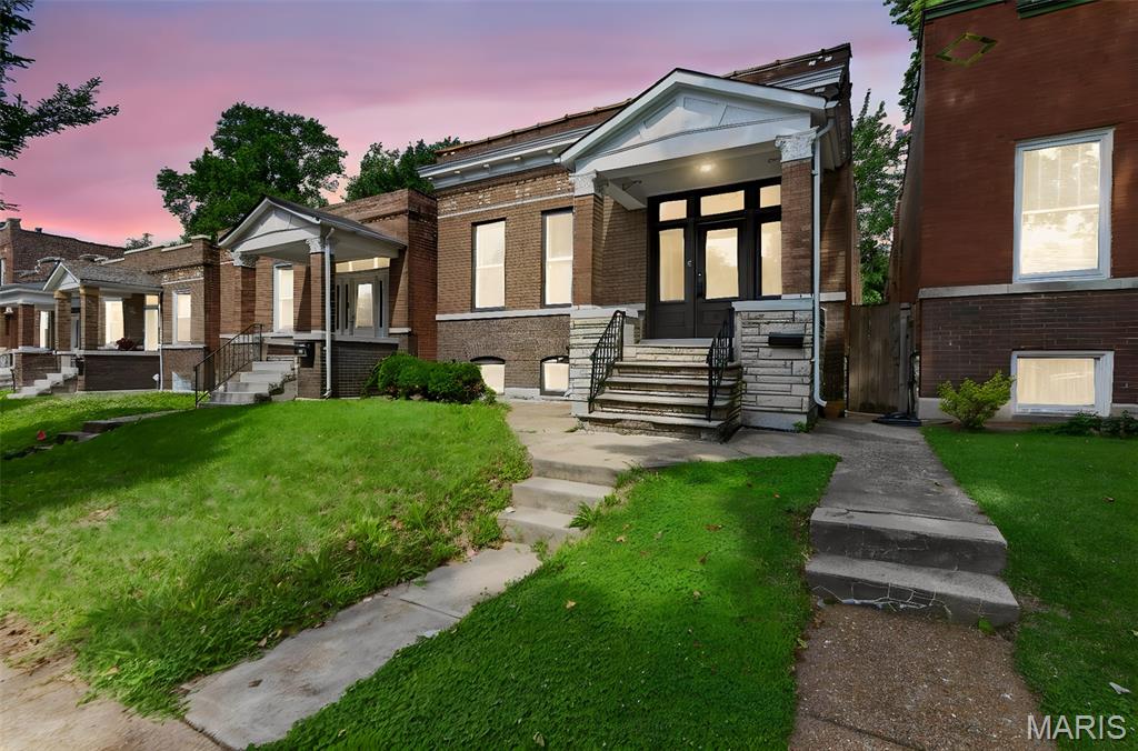 Move-in ready brick bungalow in South City, this 3-bedroom, 1-bath home offers 1,377 square feet of updated living space while keeping the character that makes these 1912 bungalows worth owning.

Refinished hardwood floors run through the main living areas, anchored by a decorative fireplace with a stone surround and the classic arched doorways original to the home. The kitchen has white shaker cabinets, butcher block countertops, a subway tile backsplash, and stainless-steel appliances. The full bath features a tiled tub surround and updated fixtures. Fresh paint, new lighting, and new door hardware carry throughout.