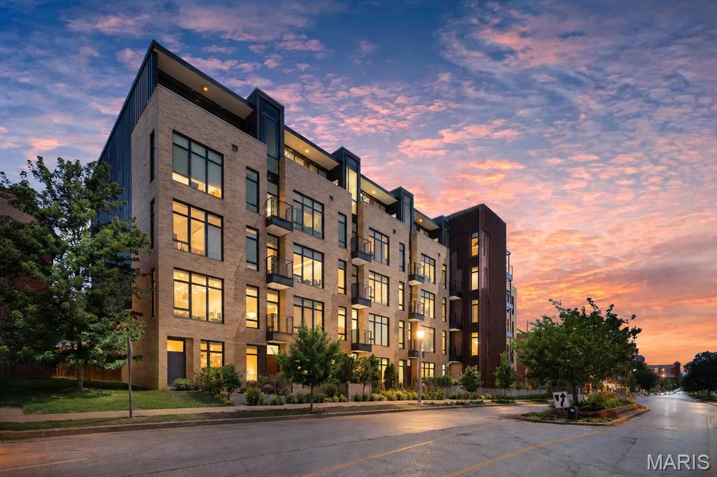 Welcome to this luxury private-entry townhome living in the Central West End with high-end finishes, thoughtful design, and full-service amenities. This two-story townhome blends modern design with comfort in a way that makes everyday living feel a little more special. The kitchen is a true chef’s dream, featuring a waterfall quartz countertop, upgraded appliances, soft-close drawers, a custom glass backsplash, and an oversized peninsula perfect for gathering, prepping, or lingering over coffee. Thoughtful, upscale finishes continue throughout the home, including wide-plank flooring, 10-foot ceilings, a Nest thermostat, upgraded bedroom carpeting, and a gas fireplace. There is a well-appointed half bathroom off the kitchen. On the ground level, the private patio creates an easy extension of your living space outdoors. The floor-to-ceiling windows offer an abundance of natural light! The sophisticated primary suite offers a fully customized 8 x 7 foot walk-in closet and a spa-inspired bath with beautiful tile, double sinks, a separate walk-in shower, and a jetted tub designed for unwinding at the end of the day. The second bedroom boasts a balcony overlooking the front patio. In unit laundry room on the second floor, the washer and dryer stay! Parking is simple and convenient with a dedicated space located right outside the back door in the enclosed garage. Residents enjoy unmatched amenities, including a gorgeous pool deck, a fire pit, a fitness center, a clubhouse lounge, private storage space, and more. This is luxury private living with all the perks of a condo building, set in the Central West End. So close to Wash U, SLU, hospitals, City Foundry, Forest Park, shops, restaurants, a community garden, and more. Welcome home!