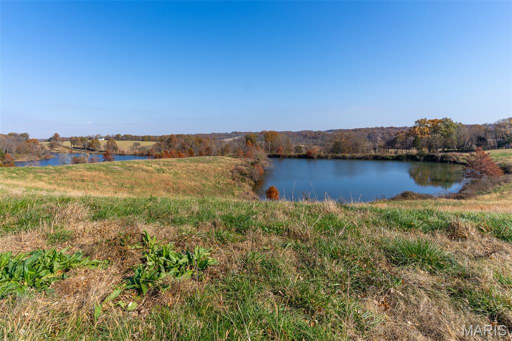 Discover 157+/- acres of highly versatile Southeast Missouri land, selling at public auction in four separate tracts or any combination, from an 11+/- acre parcel to an expansive 83+/-acre offering. Located on a quiet dead-end road, the property provides privacy with convenience, positioned just 25 minutes from downtown Cape Girardeau and 15 minutes from the Cape Girardeau Regional Airport. Electric and communications are available along the road frontage for easy development. The farm is fully fenced and cross-fenced with multiple automatic waterers, supporting a seamless livestock operation. Land features include 65+/- acres of mature timber, approximately 12+/- acres of surface water across three ponds, and a stunning 9+/- acre lake surrounded by beautiful cypress trees, an ideal backdrop for fishing, waterfowl habitat, or a showpiece homesite. The balance of the acreage is productive pasture suitable for grazing or hay. Multiple build sites throughout the property offer elevated views and quiet settings. For the outdoorsman, the property presents strong hunting opportunities for deer, turkey, waterfowl, and small game. Whether you're seeking recreational land, a working farm, investment property, or a place to build, this auction presents a rare chance to buy premium acreage in a highly desirable location.

Auction Date: 12/12/25 @ 10:00am | Drury Plaza Hotel, Cape Girardeau, MO
Open Farm: 12/7/25 from 1:00-4:00pm