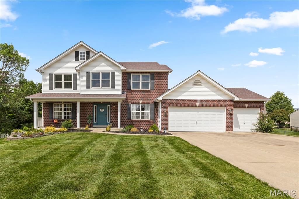 Welcome to your extraordinary 2 story 4 bed/4 bath, 2500+sq ft brick front elevation dream home on a cul-de-sac with a private backyard in the sought-after Addyston Place subdivision and desirable Francis Howell Central School District. As you step into the foyer, you will be greeted by the sunlit foyer with gleaming Malaysian hardwood floors throughout the main floor, soaring 9ft ceilings, a window wall, and plentiful recessed lighting. The cozy great room has its own gas fireplaces & the eat-in kitchen features a stunning backsplash, bright white 42" custom cabinets, quartz countertops, stainless steel appliances, a large custom center island with plenty of storage, and a hood over the NEW gas cooktop. The main floor also includes a separate dining room, a large office & convenient laundry with additional storage. The 2nd floor boasts a bonus loft area with hardwood floors, a dreamy master bedroom suite with a spacious walk-in closet with custom storage, and a luxurious master bath equipped with a double vanity, soaking tub & separate shower. The master bedroom just had BRAND NEW carpet installed. The 2nd floor has three additional spacious bedrooms with hardwood floors and a second full bath. All the bedrooms were freshly painted. The spacious finished walk-out basement features luxury vinyl plank flooring throughout, a full bath, and ample space to entertain, create a gym, or use for additional storage. Home has always been occupied by original owners and all big ticket items replaced at some point of ownership. Step outside the kitchen to enjoy your spacious deck, perfect for relaxing and taking in views of the private, level, fenced in backyard. The three-car garage provides plenty of space for storage and vehicles. This house has it all and is a MUST SEE!
